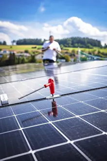 Close-up of a solar module with a working person in a rural area