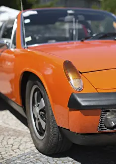 Close-up view of orange retro car headlight