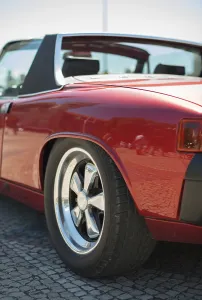 Close-up view of red retro car headlight