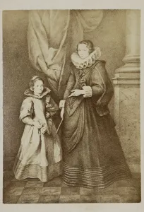 Closeup of a 19th century vintage photo of an american noble woman and a child posing in a fancy ball dresses