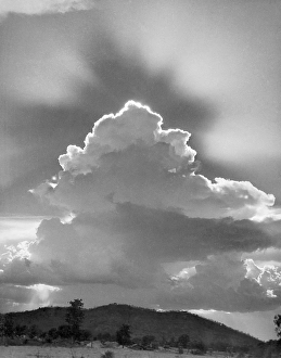 Clouds cape of sky with silver lining in afternoon, India 1940's