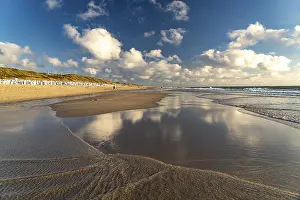 Clouds reflected in the water on the west beach near Westerland