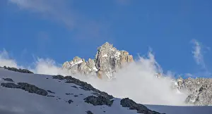 Clouds and rocky mountain peaks