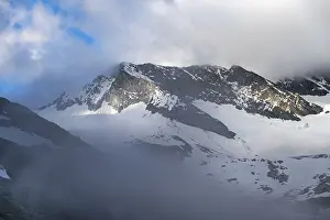 Cloudy glaciated summit Dosso Largo with glacier Schlegeiskees