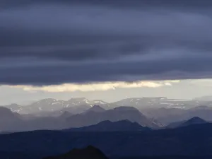 Cloudy mood and evening light, view from Mount Sveinstindur