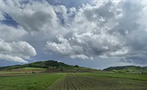 Cluster clouds (cumulus) over the landscape in the southern Carpathian Arc