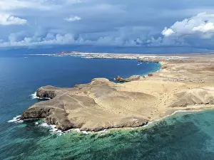 Coast with Playa de Papagayo beach and Playa Caleta del Congrio and blue sea