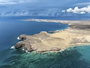 Coast with Playa de Papagayo beach and Playa Caleta del Congrio and blue sea