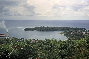 Coastal landscape with a view of a ship in the harbour and the marina island in Port Antonio, Jamaica, 1970, Central America