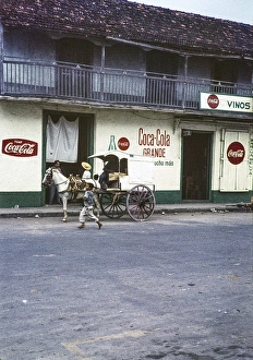 Coca Cola advert on the side of a cafe canteen, streets of El Progreso, Yucatan Peninsula, Mexico, 1961, Central America