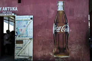 Coca Cola advertising and the open door of a restaurant
