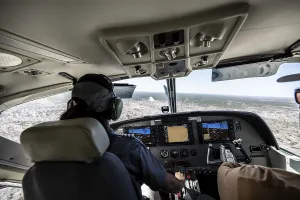 Cockpit Cesna Caravan with pilot on approach to Airstrip