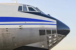 Cockpit of a large vintage civilian plane with blue stripes isolated closeup