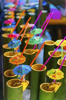 Cocktails in bamboo tubes at the evening market of Krabi