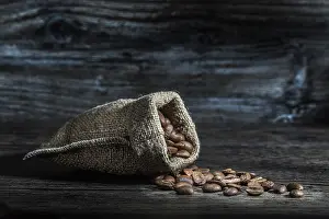 Coffee beans scattered from sack