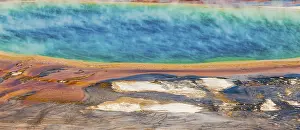 Colored mineral deposits at the edge sr steaming hot spring