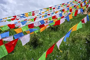 Colorful buddhist praying flags by Mati Si cave temple