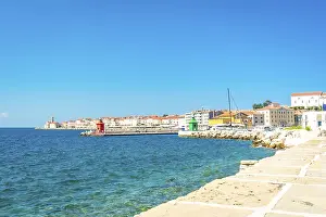 Colorful buildings line the coast of piran