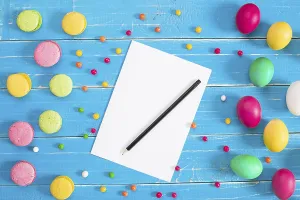 Colorful easter eggs on blue rustic wooden background