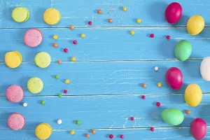 Colorful easter eggs on blue rustic wooden background