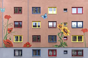 Colorful flower paintings on the facade of an apartment building