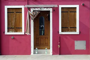 Colorfully painted building facade and entrance in Burano