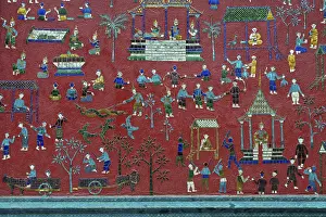 Coloured glass mosaic on a red wall