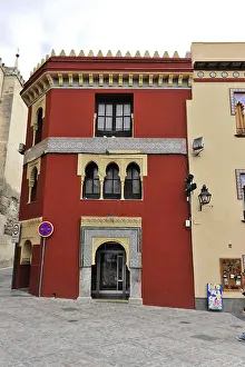 Colourful building with rich ornamentation in an urban setting
