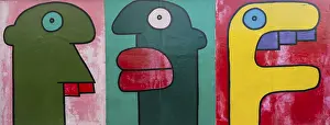 Colourful comic-style heads, paintings at the Berlin Wall