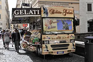 A colourful ice cream van on a busy street