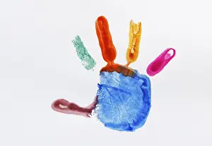 Colourful impression of a painted child's hand<br> Colourful impression of a painted child's hand