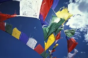 Category Buddhism Prints: Colourful prayer flags flying in the wind
