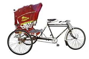Colourful red cycle rickshaw on white background
