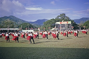 Colourful young male and female dancers, Port of Spain, Trinidad c 1962 independence pageant