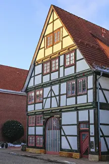 Framed Print : Colourfully painted facade of a 16th century timbered house on Krankenhager StraBe Framed Print : Colourfully painted facade of a 16th century timbered house on Krankenhager StraBe