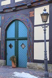 Colourfully painted gate entrance of a 16th century half-timbered house in BackerstraBe