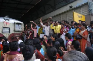 Commuters stage protest as they stop trains demanding increase in local train frequency at Airoli Station