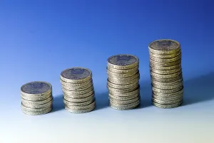 Concept, growth Indian five rupees coins arrange in stack on blue white background