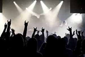 Concert-goers, audience, holding up their hands