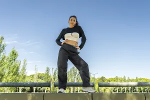 Confident urban dancer striking a pose in a sunny park