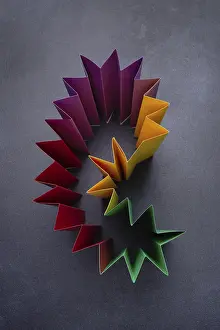 Construction of colored paper on a dark background