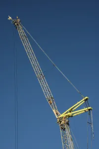 Construction crane against blue sky in Ystad