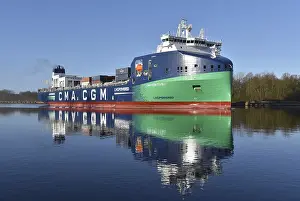 Container ship CMA CGM TIVOLI sailing in the Kiel Canal