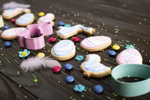 Cookie cutters feathers and Easter frosted cookies in shape of egg