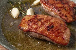Cooking duck breast, in a frying pan