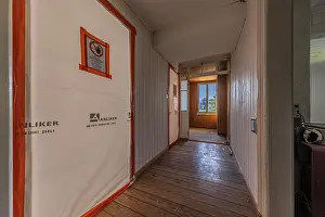 Corridor with protection during asbestos removal of a multi-storey residential building built in 1903 prior to