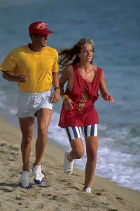 Couple on the beach jogging