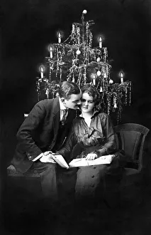 Couple celebrates Christmas, around 1920
