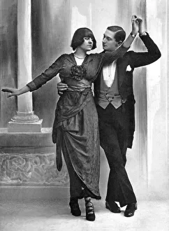 Couple dances with serious gaze