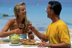 Couple eating by the sea